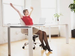 58-woman-stretching-at-desk-lgn